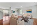 Comfortable living room with neutral tones, hardwood floors, and natural light from a large window at 330 Albrighton Way, Moncks Corner, SC 29461