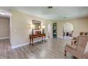 Bright living room features hardwood floors, arched doorways and a classic design at 403 Forest Cir, Summerville, SC 29483