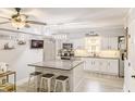 Beautiful kitchen with white cabinets, stainless steel appliances, granite countertops, and a large island at 49 Auld Brass Rd, Walterboro, SC 29488
