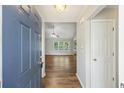 Open foyer with hardwood floors and a view into the brightly lit living area at 527 Hainsworth Dr, Charleston, SC 29414