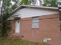 Brick house with a side door. The house needs some TLC at 604 King St, Walterboro, SC 29488