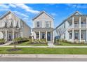 Charming two-story home with a well-manicured lawn at 619 Trio Ln, Summerville, SC 29486