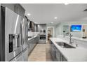 Modern kitchen showcasing an open layout with stainless steel appliances and quartz countertops at 710 W Harrison Rd, Charleston, SC 29407