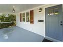 Charming covered porch featuring painted floors, updated lighting, and charming accents at 81 Avondale Ave, Charleston, SC 29407