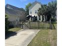 Spacious backyard featuring a well-kept lawn and a gazebo, enclosed by a wooden fence at 86 Cross Timbers Dr, Summerville, SC 29485