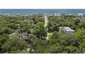 Picturesque coastal community with homes nestled among lush greenery, leading to a beautiful ocean view at 912 Cheehaw St, Edisto Island, SC 29438