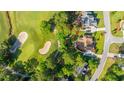 An aerial view showcases the property's proximity to a golf course and the surrounding green landscape at 1187 Out Of Bounds Dr, Summerville, SC 29485