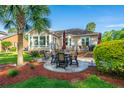 Outdoor living is made easy with a patio, outdoor dining and beautiful yard views at 1187 Out Of Bounds Dr, Summerville, SC 29485