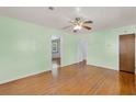 Spacious bedroom boasts hardwood floors, a ceiling fan, and multiple doorways at 1222 Maxwell St, North Charleston, SC 29405