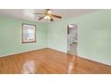 Bright bedroom with hardwood floors, a ceiling fan, and ample natural light at 1222 Maxwell St, North Charleston, SC 29405