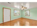 Inviting bedroom featuring hardwood floors, two windows, and fresh paint at 1222 Maxwell St, North Charleston, SC 29405