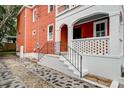 Side view of entryway with brick stairs and well-maintained landscaping and front door at 15 Dewey St, Charleston, SC 29403
