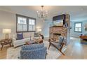 Cozy living room featuring a brick fireplace, plush rug, and stylish furniture at 15 Dewey St, Charleston, SC 29403