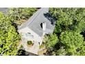 Aerial shot of a home surrounded by mature shade trees and professional landscaping at 1551 Ben Sawyer Blvd # 23, Mount Pleasant, SC 29464