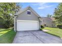 Spacious attached two-car garage and driveway with a neatly landscaped yard at 1572 Pixley St, Charleston, SC 29414
