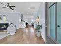 Inviting home entryway, featuring hardwood floors, a cozy fireplace, and an open floor plan at 1614 Prince Edward St, Mount Pleasant, SC 29466