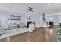 Bright living room features a fireplace, stylish furnishings, and hardwood floors, creating a warm and inviting space at 1614 Prince Edward St, Mount Pleasant, SC 29466
