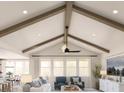 Bright and airy living room featuring vaulted ceilings, exposed beams, plush seating, and natural light at 2034 Mcguire Ln # 009, Hollywood, SC 29449