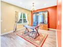 Bright home office featuring a stylish desk, decorative rug, and ample natural light from a large window at 204 Lynx Ln, Summerville, SC 29483