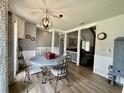 Charming dining area featuring a round table, stylish chairs, and decorative lighting at 207 Longstreet St, Summerville, SC 29486