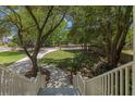 A view from the top of the stairs showing the driveway, sidewalk, and the lush front yard of the home at 3021 Rushland Mews, Johns Island, SC 29455