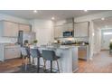 Stylish kitchen with stainless appliances, ample counter space, and seating at the island at 303 Willow Run Dr, Summerville, SC 29486