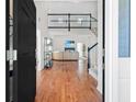 Warm and inviting foyer with hardwood floors, staircase, and view into the living room at 350 Arlington Dr, Charleston, SC 29414