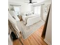 Serene bedroom showcases a plush bed, large windows, and stylish decor elements at 404 Rose Ln, Summerville, SC 29485