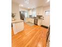 Updated kitchen boasts granite countertops, stainless steel appliances, and ample natural light at 404 Rose Ln, Summerville, SC 29485