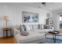 Cozy living room featuring a comfortable sectional sofa, stylish decor, and ample natural light at 4319 Sea Forest Dr, Kiawah Island, SC 29455