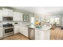 Bright, spacious kitchen with stainless steel appliances, granite countertops, and an open floor plan at 538 Richfield Way, Summerville, SC 29486