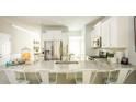 Kitchen with stainless steel appliances and a large island with seating for four at 538 Richfield Way, Summerville, SC 29486