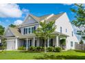 Side view of a lovely home with a well-manicured lawn and lush landscaping at 8009 Indian Hill Dr, Hanahan, SC 29410