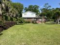 Well-maintained lawn and lush greenery surround this home, creating a serene and inviting outdoor space at 912 Kincade Dr Dr, Mount Pleasant, SC 29464