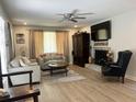 Bright living room featuring a brick fireplace, flat screen TV, and comfortable seating area at 912 Kincade Dr Dr, Mount Pleasant, SC 29464