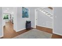 Hallway with hardwood floors, neutral walls, and natural light, leading to other rooms in the home at 1001 Foxcroft Rd, James Island, SC 29412