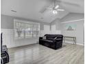 Spacious living room with vaulted ceiling and large windows providing plenty of natural light at 109 Wisteria Ct, Summerville, SC 29486