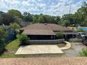 Expansive backyard with a spacious concrete patio and partial fence, perfect for outdoor entertaining and gatherings at 111 Craven Rd, Ladson, SC 29456