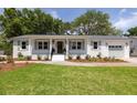 Inviting single-story home with fresh landscaping and a well-maintained lawn, exuding curb appeal at 1199 Island View Dr, Mount Pleasant, SC 29464