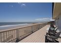 Expansive deck with ocean views and comfortable seating at 128 Palmetto Blvd, Edisto Beach, SC 29438