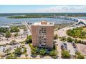 Aerial view of building, with nearby bridges, waterways, and marina at 14 Lockwood Dr # 6I, Charleston, SC 29401