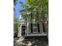 Attractive two-story home with a welcoming porch and well-maintained landscaping at 1418 Whispering Oak Trl, Mount Pleasant, SC 29466
