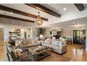 Spacious living room featuring exposed wood beams, hardwood floors, and an open concept design at 15 Edgewater Aly, Isle of Palms, SC 29451