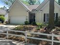 Charming single-Gathering home with a well-maintained front yard and attached garage at 1578 Harborsun Dr, Charleston, SC 29412