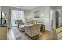 Bright living room with natural light, comfortable seating, and sliding glass door to balcony at 1600 Long Grove Drive # 811, Mount Pleasant, SC 29464