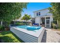 Backyard showcasing a pool, patio area, and landscaped surroundings, creating a private outdoor retreat at 169 Callibluff Dr, Summerville, SC 29486