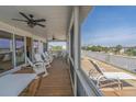 Relaxing screened porch with ample seating, perfect for enjoying the coastal breeze at 1701 A Palmetto Blvd, Edisto Island, SC 29438