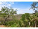 Scenic marsh landscape with lush greenery, tall trees, and open blue skies at 1801 Landfall Way, Seabrook Island, SC 29455
