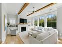 Bright living room featuring a fireplace, built-in shelving, and large windows at 2 Piedmont Ave # A, Charleston, SC 29403