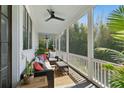Relaxing screened porch with comfortable seating and serene outdoor views at 2 Piedmont Ave # A, Charleston, SC 29403